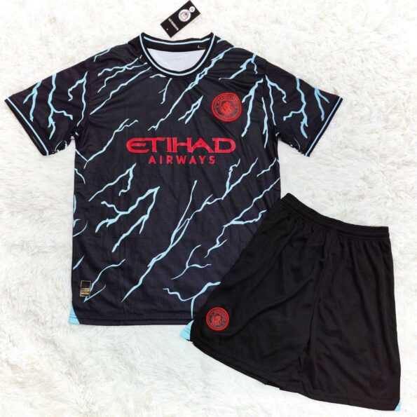 Bộ quần clb mc manchester man city 2023 mẫu thứ 3 xanh chuối hoạ tiết đen logo thêu gai thái 1