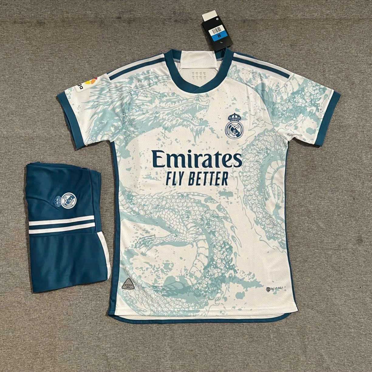 Bộ quần áo đá banh clb bóng đá Real Madrid MFC trắng logo thêu in hình rồng xanh dragon jersey 1