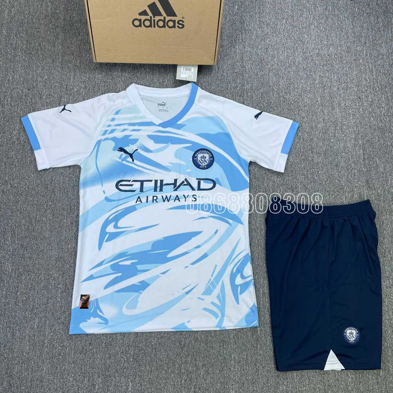 Áo đá bóng MC Manchester Man City 2024 xanh trắng vải caro thái mới quần tím than full logo ngực thêu